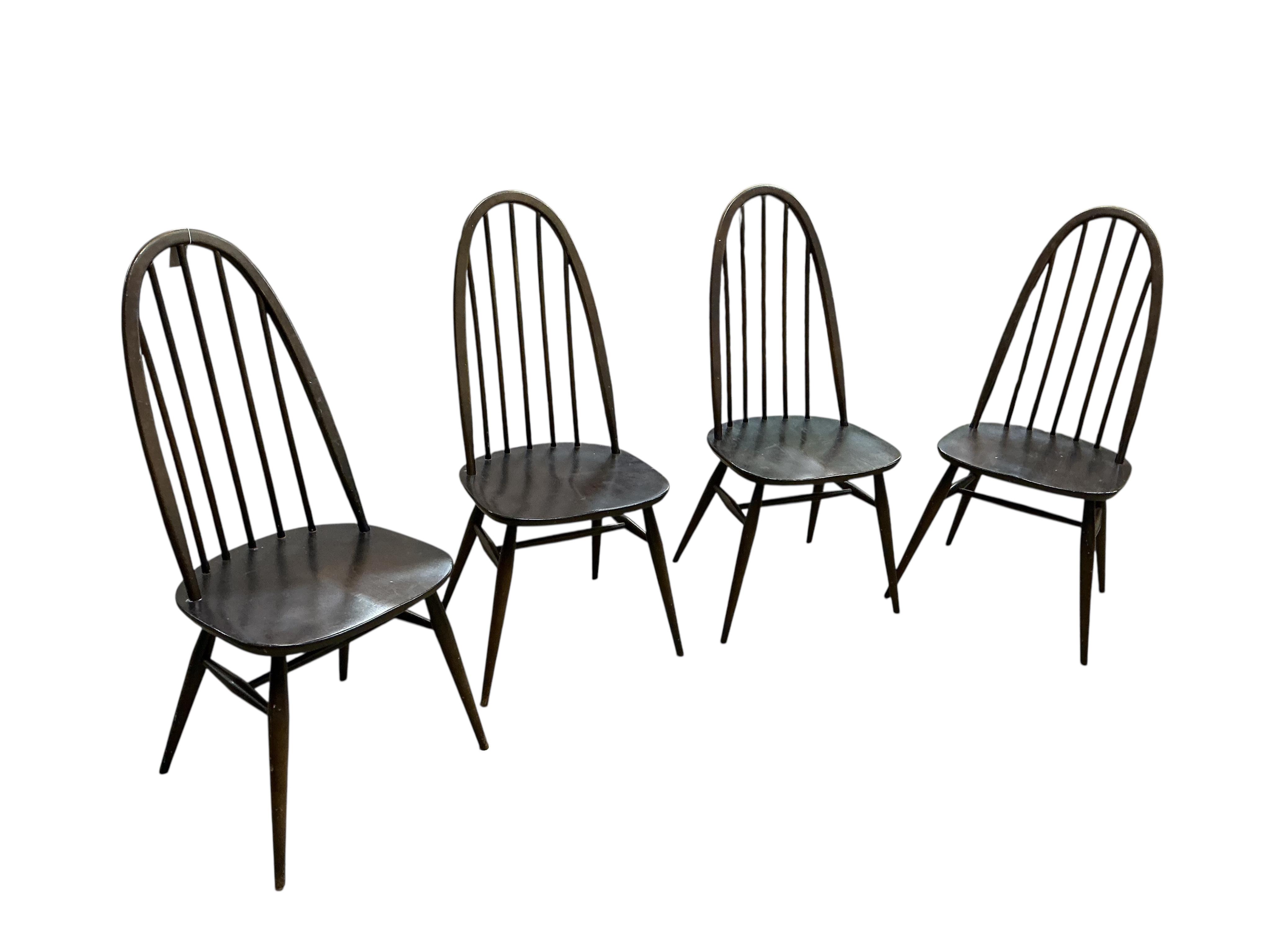 An Ercol dark elm rectangular dining table, width 150cm, depth 77cm, height 72cm and four Ercol chairs